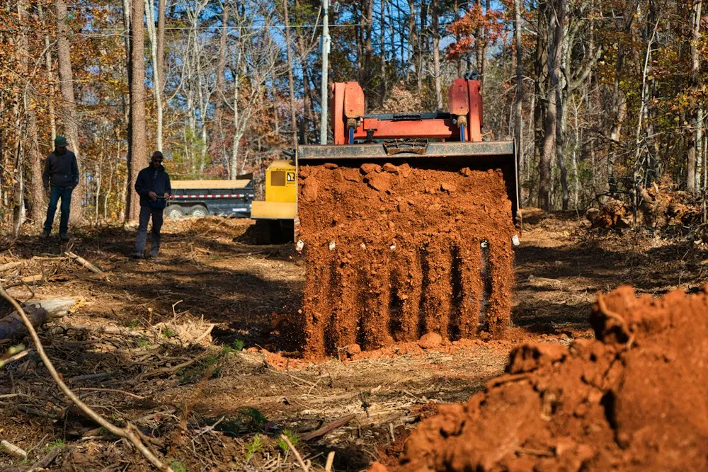 Excavator digging on a residential job site