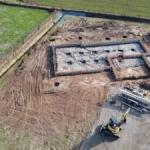 Excavator digging a new home foundation