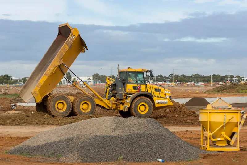 Bulldozer grading a dirt construction site